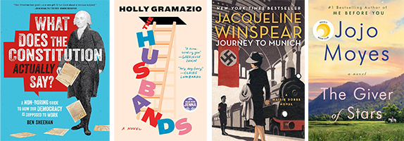Four book covers displayed side by side: "What Does the Constitution Actually Say?" by Ben Sheehan, "Husband" by Holly Gramazio, "Journey to Munich" by Jacqueline Winspear, and "The Giver of Stars" by Jojo Moyes. Each cover features distinct artwork and typography relevant to its title.